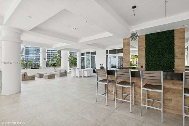 801 Brickell Key Blvd Unit 2202, Miami, FL 33131 - kitchen with a raised ceiling, open floor plan, and light tile patterned flooring