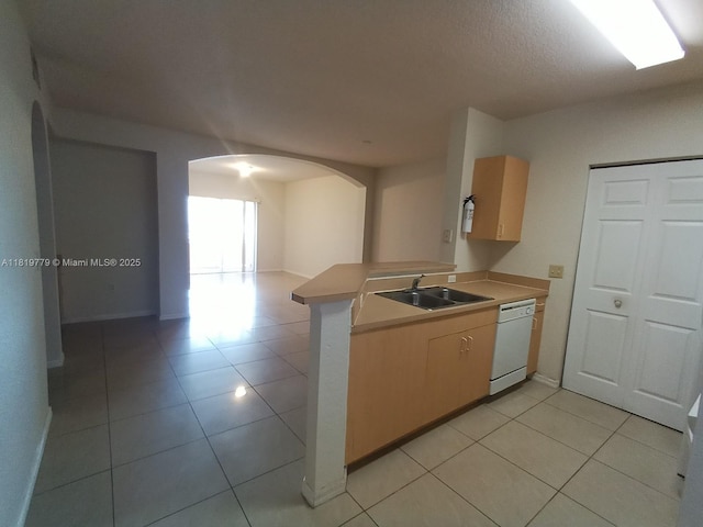 503 Belmont Ln Unit 503, North Lauderdale, FL 33068 - kitchen featuring white dishwasher, arched walkways, open floor plan, a peninsula, and light countertops