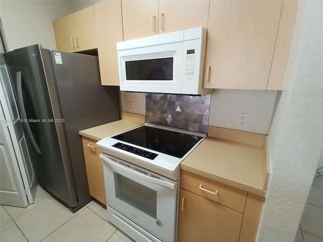 503 Belmont Ln Unit 503, North Lauderdale, FL 33068 - kitchen with white appliances, backsplash, light countertops, light tile patterned floors, and light brown cabinets