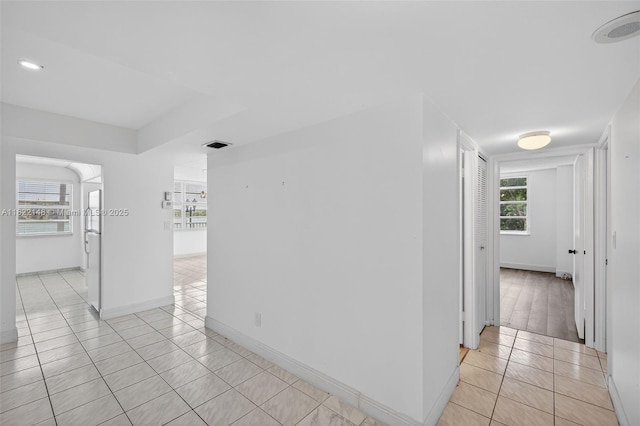2851 NE 183rd St Unit 216E, Aventura, FL 33160 - hall featuring light tile patterned floors and baseboards