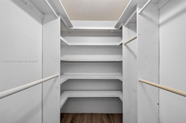 2851 NE 183rd St Unit 216E, Aventura, FL 33160 - walk in closet featuring wood finished floors