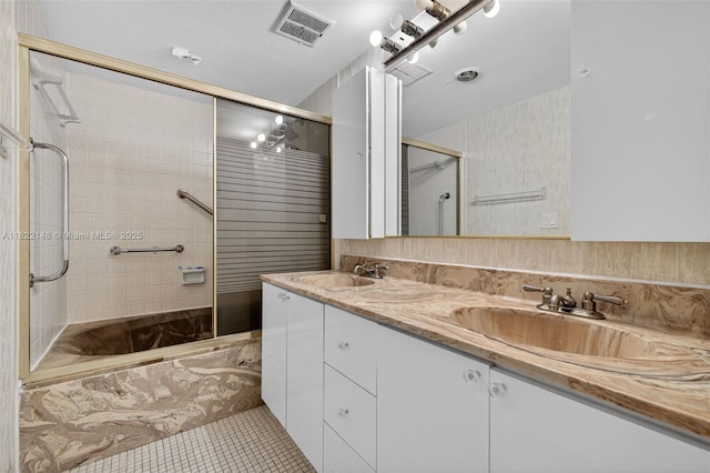 2851 NE 183rd St Unit 216E, Aventura, FL 33160 - bathroom featuring tiled shower, tile patterned floors, and double vanity