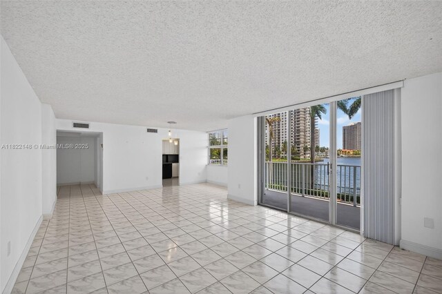 2851 NE 183rd St Unit 216E, Aventura, FL 33160 - spare room with a textured ceiling