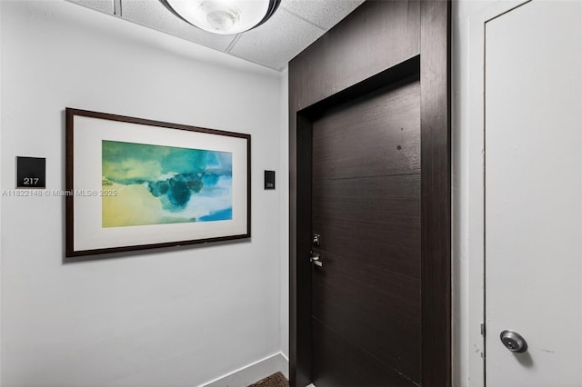 2851 NE 183rd St Unit 216E, Aventura, FL 33160 - hallway with a drop ceiling and baseboards