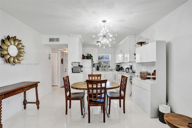 7502 NW 30th Pl Unit 112, Sunrise, FL 33313 - dining room with a chandelier and light tile patterned floors