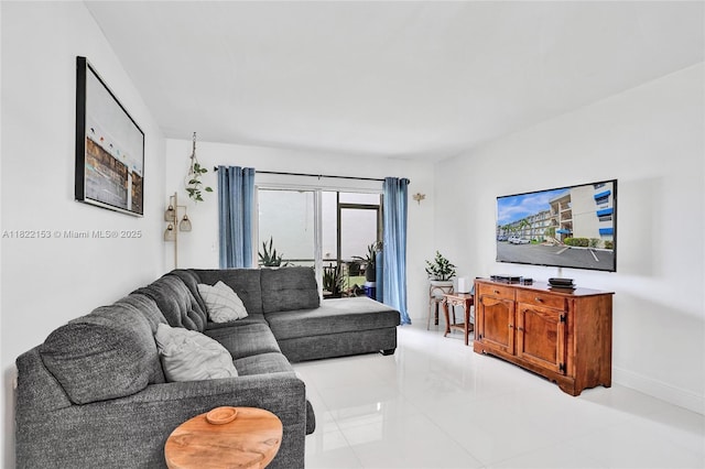7502 NW 30th Pl Unit 112, Sunrise, FL 33313 - living room featuring light tile patterned flooring and baseboards