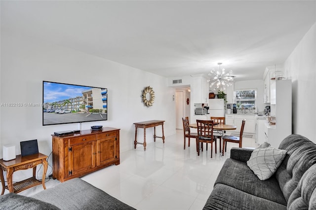 7502 NW 30th Pl Unit 112, Sunrise, FL 33313 - living area featuring a chandelier and light tile patterned floors
