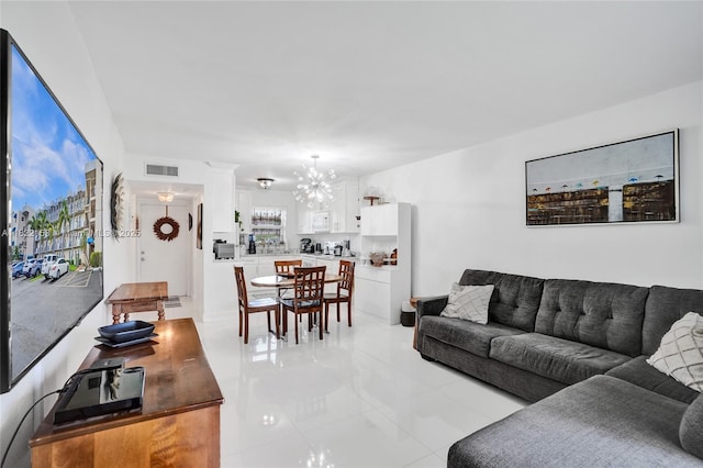7502 NW 30th Pl Unit 112, Sunrise, FL 33313 - living room with a chandelier and light tile patterned floors