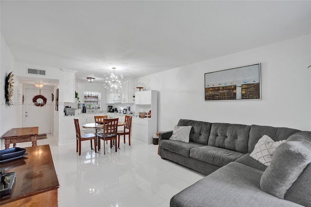 7502 NW 30th Pl Unit 112, Sunrise, FL 33313 - living room featuring light tile patterned flooring and a chandelier