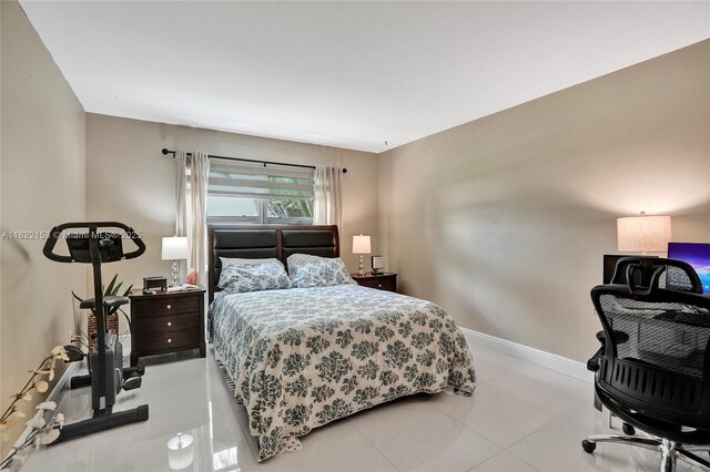 7502 NW 30th Pl Unit 112, Sunrise, FL 33313 - tiled bedroom with an office area and baseboards