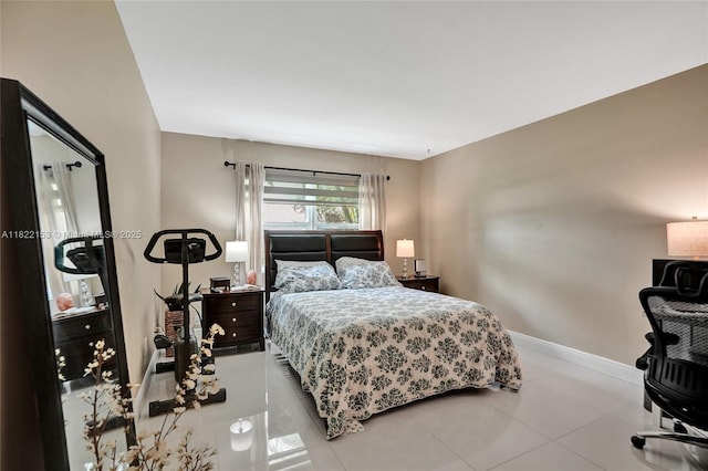 7502 NW 30th Pl Unit 112, Sunrise, FL 33313 - bedroom with baseboards and tile patterned floors