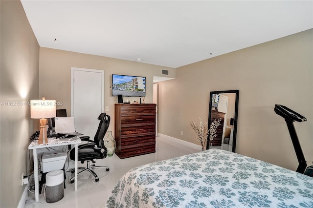 7502 NW 30th Pl Unit 112, Sunrise, FL 33313 - bedroom featuring tile patterned flooring and an office area
