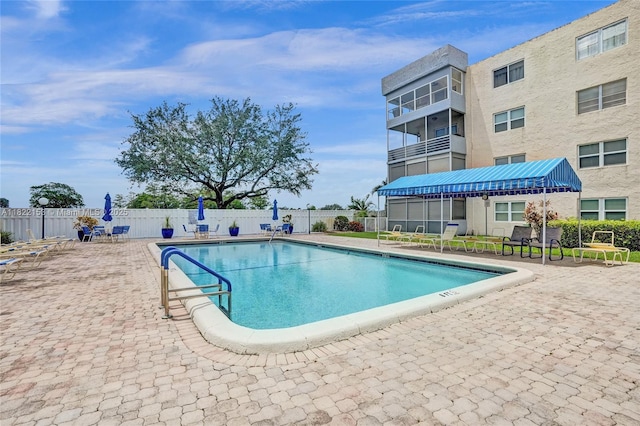 7502 NW 30th Pl Unit 112, Sunrise, FL 33313 - community pool featuring a patio