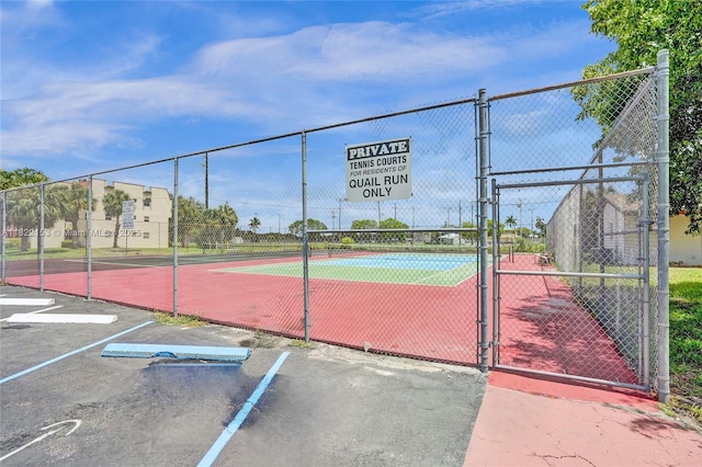 7502 NW 30th Pl Unit 112, Sunrise, FL 33313 - view of tennis court featuring a gate
