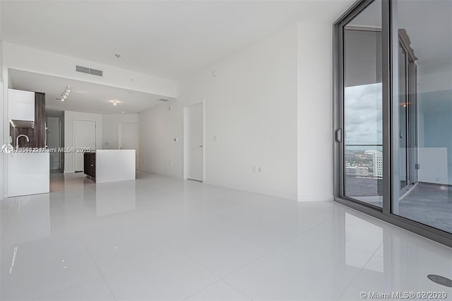 851 NE 1st Ave Unit 1608, Miami, FL 33132 - unfurnished living room featuring tile patterned floors