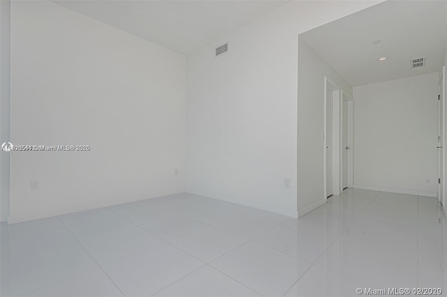 851 NE 1st Ave Unit 1608, Miami, FL 33132 - empty room with light tile patterned floors and recessed lighting