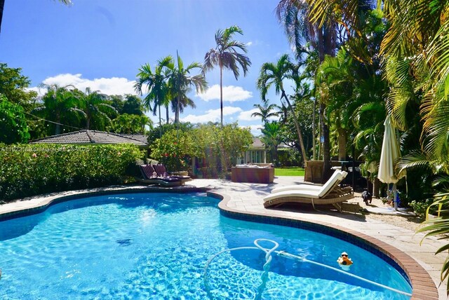 13200 SW 59th Ave, Pinecrest, FL 33156 - swimming pool with a patio area
