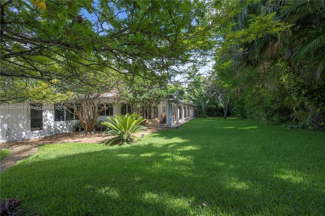 13200 SW 59th Ave, Pinecrest, FL 33156 - view of grassy yard featuring a sunroom