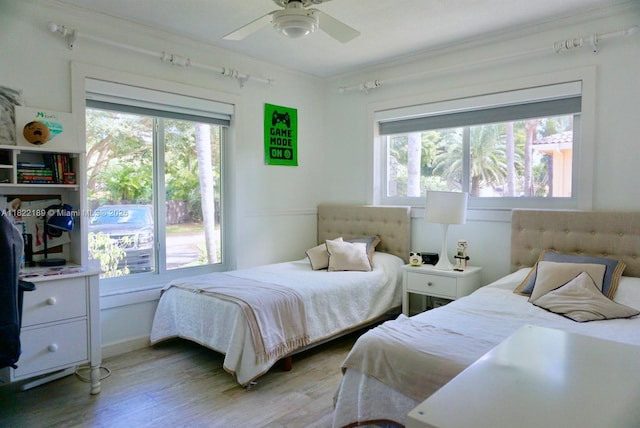 13200 SW 59th Ave, Pinecrest, FL 33156 - bedroom featuring light wood-style floors, ornamental molding, and a ceiling fan