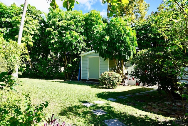 13200 SW 59th Ave, Pinecrest, FL 33156 - view of grassy yard with a storage unit