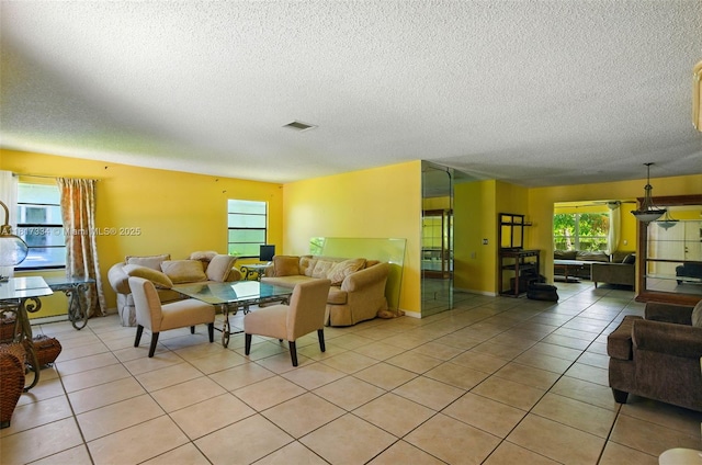 7420 SW 14th Pl, North Lauderdale, FL 33068 - living room with a textured ceiling and light tile patterned floors