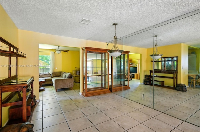 7420 SW 14th Pl, North Lauderdale, FL 33068 - dining room featuring light tile patterned floors, a textured ceiling, and ceiling fan