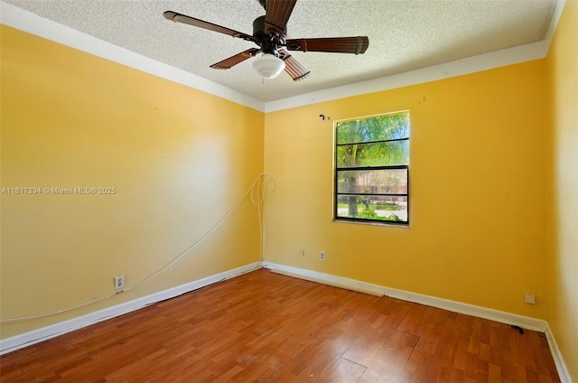 7420 SW 14th Pl, North Lauderdale, FL 33068 - spare room featuring a textured ceiling, wood finished floors, and a ceiling fan