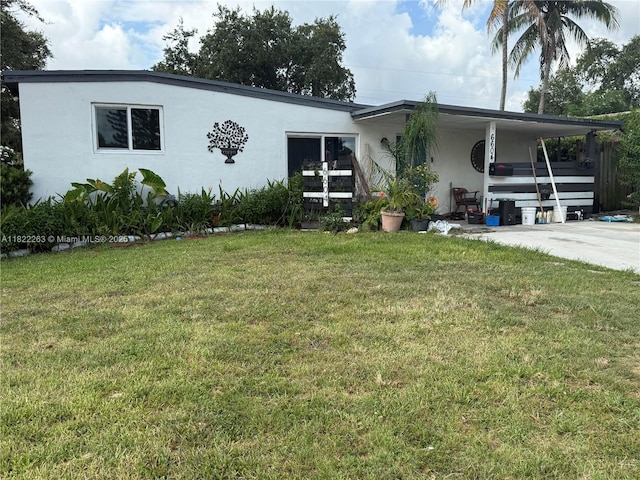 6604 Raleigh St, Hollywood, FL 33024 - view of front of home featuring stucco siding and a front yard
