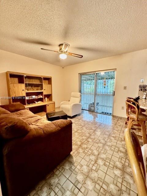 2671 SW 107th Ave, Miami, FL 33165 - living room with a textured ceiling and ceiling fan