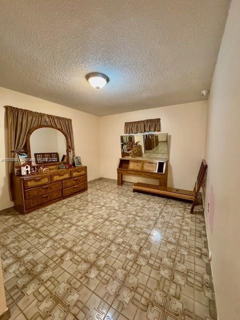 2671 SW 107th Ave, Miami, FL 33165 - bedroom with a textured ceiling