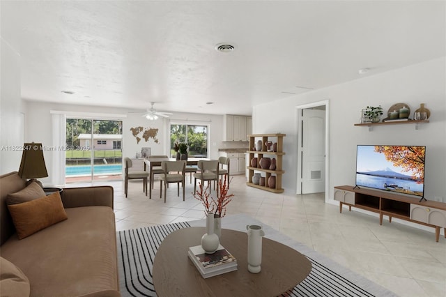 1700 SW 5th Ave, Pompano Beach, FL 33060 - living room featuring light tile patterned floors and a ceiling fan