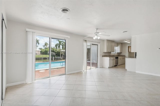 1700 SW 5th Ave, Pompano Beach, FL 33060 - unfurnished living room featuring light tile patterned flooring and ceiling fan