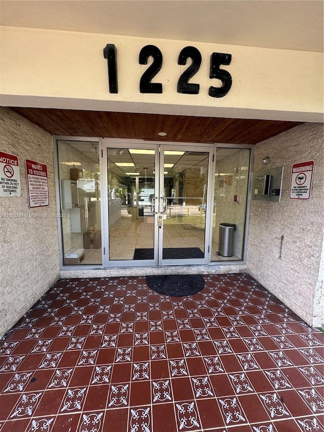 1225 NE 124th St Unit 46A, North Miami, FL 33161 - view of exterior entry featuring french doors