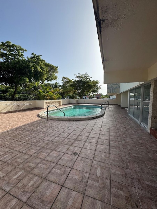 1225 NE 124th St Unit 46A, North Miami, FL 33161 - community pool featuring a patio