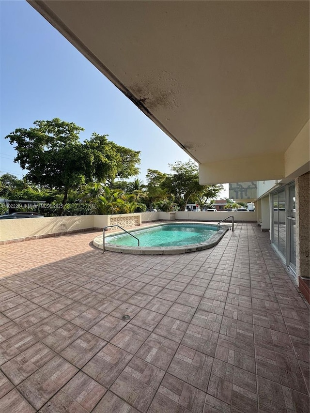 1225 NE 124th St Unit 46A, North Miami, FL 33161 - view of pool with a patio area