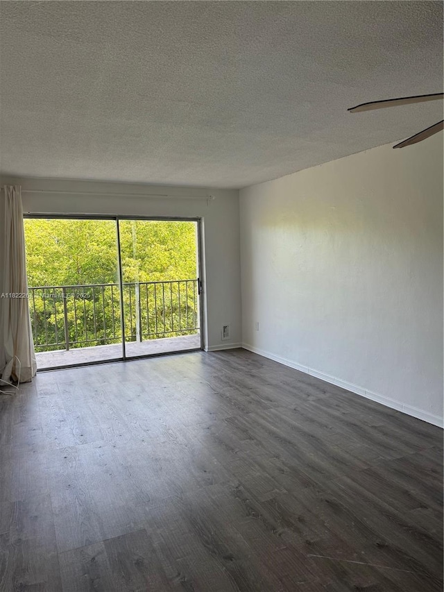 1225 NE 124th St Unit 46A, North Miami, FL 33161 - empty room featuring dark wood-style floors, a textured ceiling, and a ceiling fan