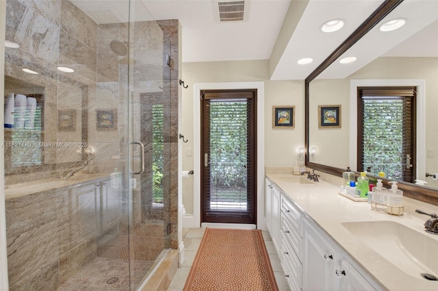 10755 Stonebridge Blvd, Boca Raton, FL 33498 - bathroom with double vanity, a stall shower, healthy amount of natural light, recessed lighting, and tile patterned flooring