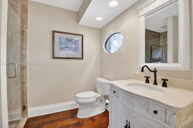 10755 Stonebridge Blvd, Boca Raton, FL 33498 - bathroom featuring vanity, a stall shower, wood finished floors, and a textured wall