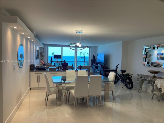 6039 Collins Ave Unit 1525, Miami Beach, FL 33140 - dining area featuring baseboards