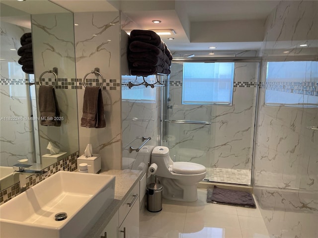 6039 Collins Ave Unit 1525, Miami Beach, FL 33140 - full bath with vanity, a marble finish shower, tile walls, and tile patterned floors