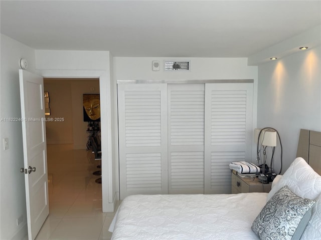 6039 Collins Ave Unit 1525, Miami Beach, FL 33140 - bedroom with a closet and light tile patterned flooring