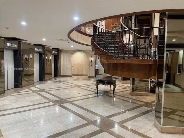 6039 Collins Ave Unit 1525, Miami Beach, FL 33140 - building lobby with recessed lighting and stairs
