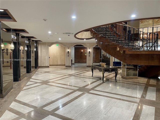 6039 Collins Ave Unit 1525, Miami Beach, FL 33140 - common area with stairs and recessed lighting