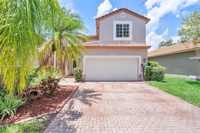 19257 NW 14th St, Pembroke Pines, FL 33029 - mediterranean / spanish-style house with decorative driveway, a tiled roof, and stucco siding