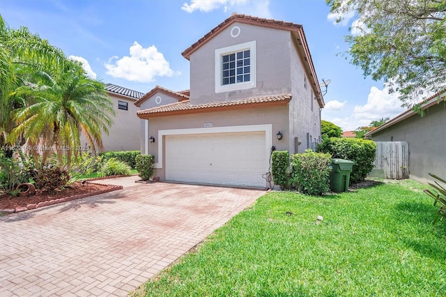 19257 NW 14th St, Pembroke Pines, FL 33029 - mediterranean / spanish home with decorative driveway, stucco siding, a garage, and a tiled roof