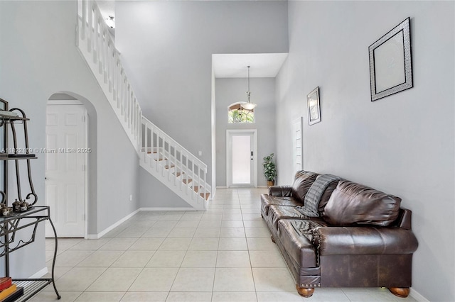19257 NW 14th St, Pembroke Pines, FL 33029 - foyer entrance with a high ceiling, arched walkways, stairway, and light tile patterned floors