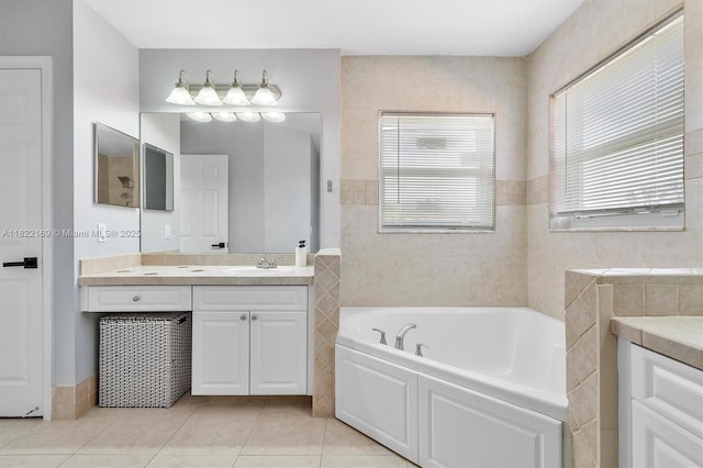 19257 NW 14th St, Pembroke Pines, FL 33029 - full bath featuring vanity, a bath, tile patterned floors, and tile walls