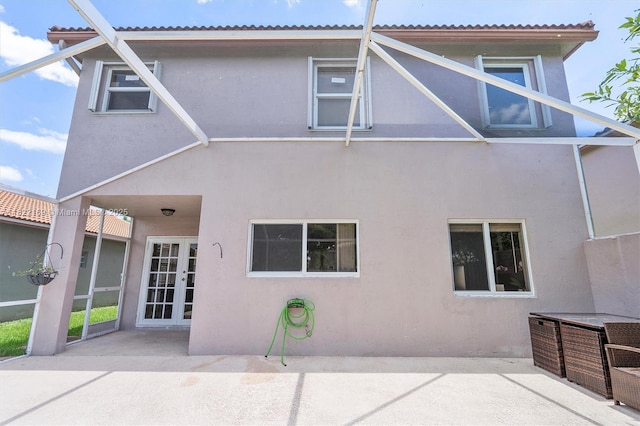 19257 NW 14th St, Pembroke Pines, FL 33029 - back of property featuring a patio, stucco siding, and french doors