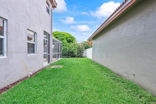 19257 NW 14th St, Pembroke Pines, FL 33029 - view of yard with a lanai