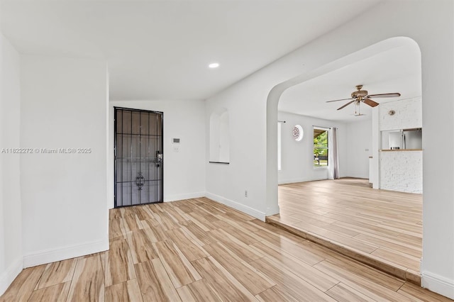 6073 NW 27th St, Margate, FL 33063 - unfurnished room with arched walkways, light wood finished floors, a ceiling fan, and recessed lighting
